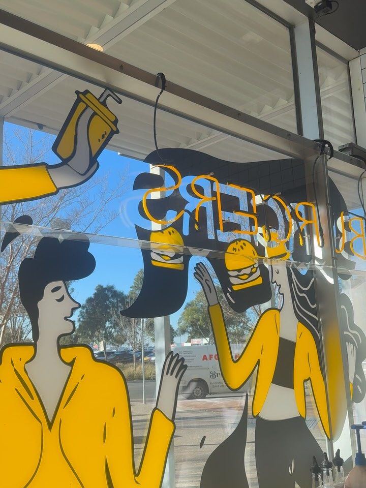 Burger bar window graphics cleaned around the decals