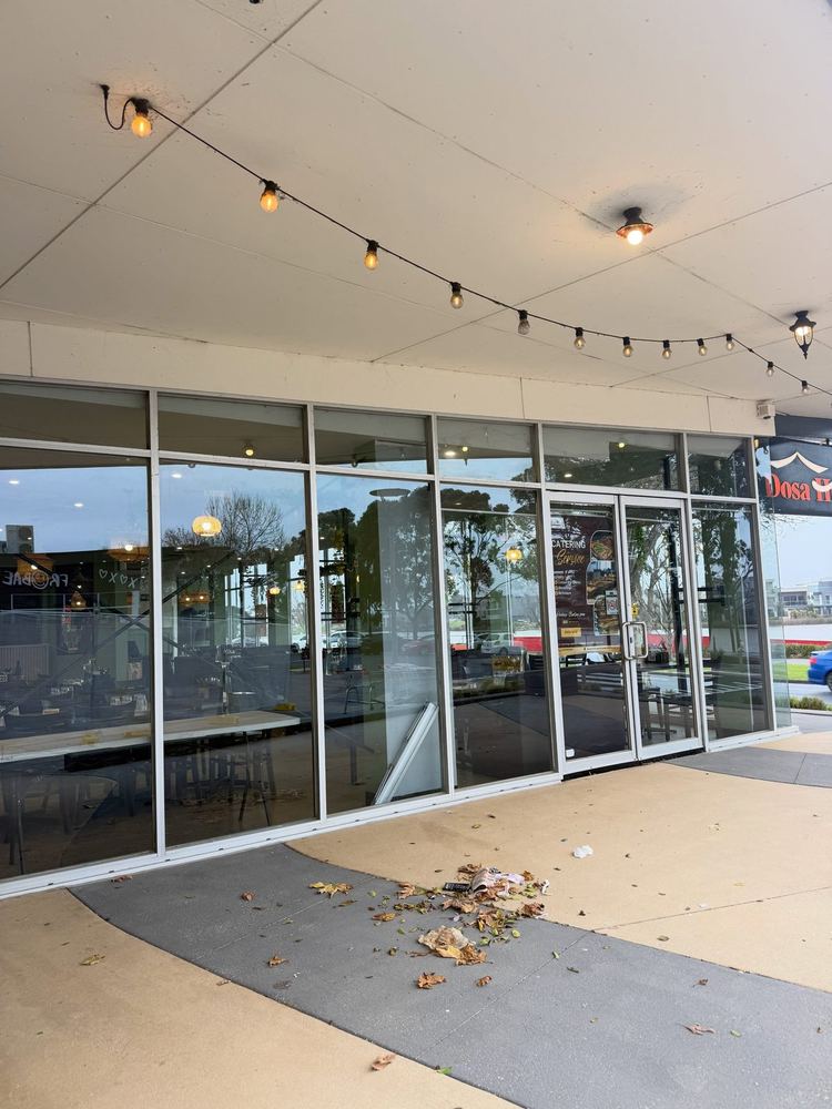 Shopfront glass and paved entry in Caroline Springs after cleaning