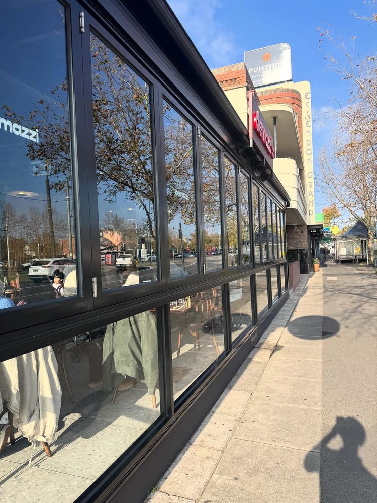 Long run of restaurant windows in Essendon after a Defeco window clean