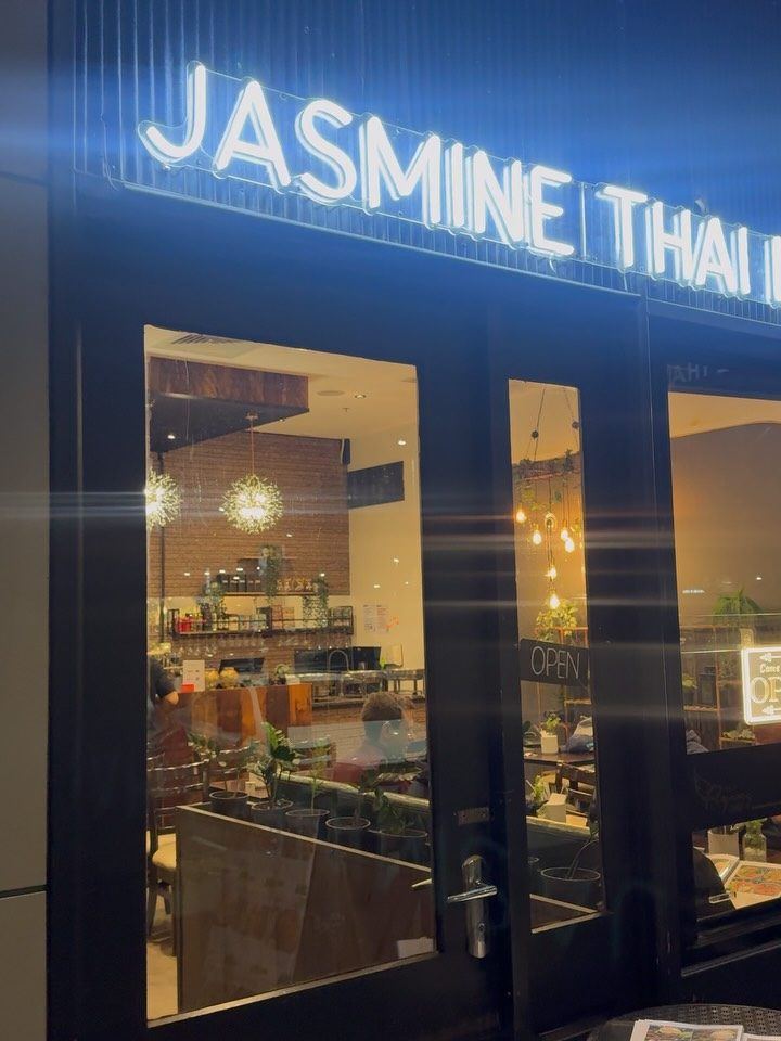 Jasmine Thai restaurant windows at night after cleaning
